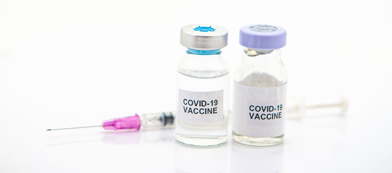 two vials of covid 19 vaccine